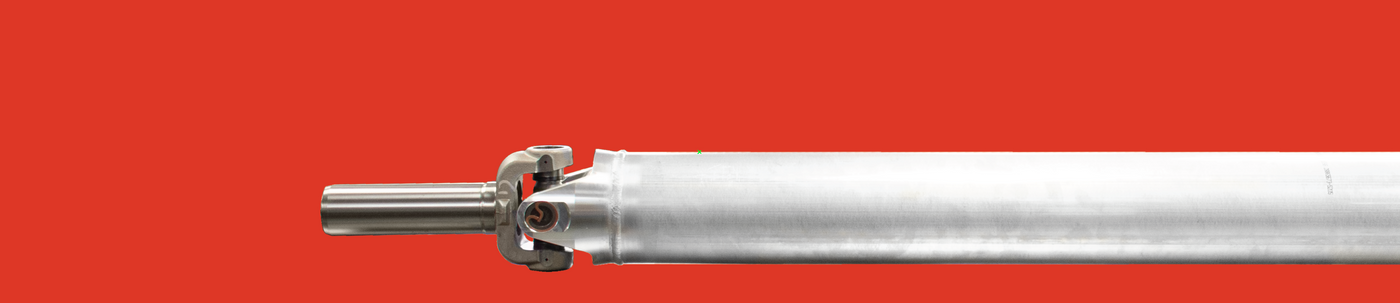 One piece driveshaft with slip yoke